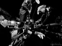 Derick Costa, left, looks on as cowboys help his son Derick Costa Jr., 10,  strap into the second bull he rode at the final event in the New England Rodeo championship in Norton, MA.